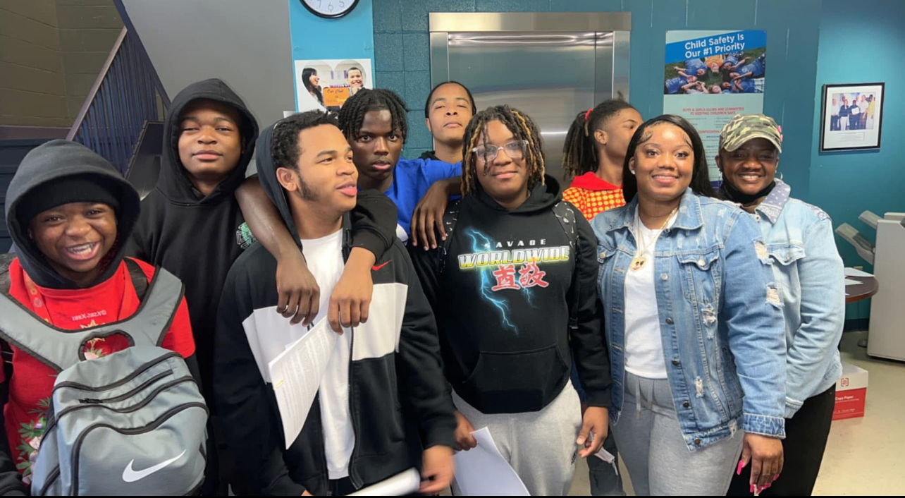 Young people and mentors together at a community program.